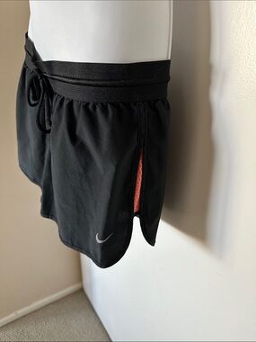 Nike Women’s Black Athletic Shorts with Coral Side Accent